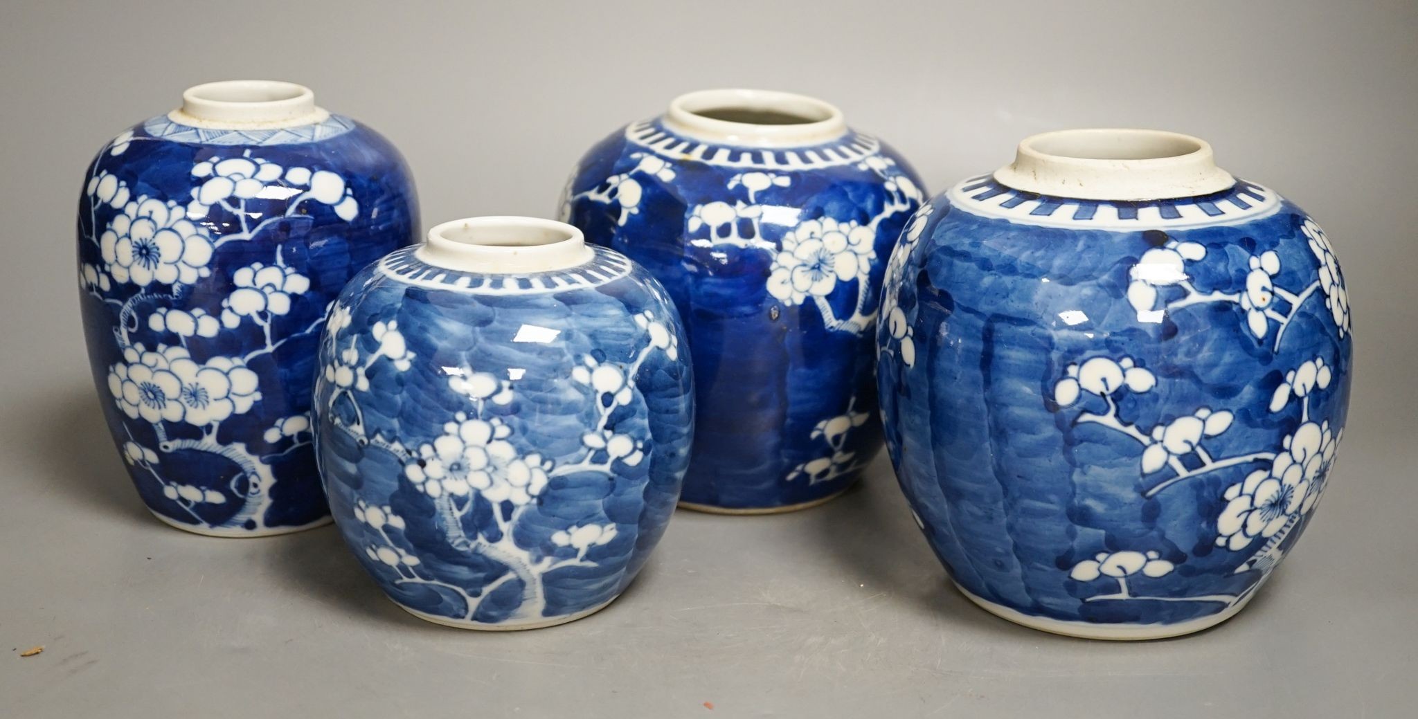 Eight various Chinese blue and white ‘prunus’ jars, largest 16 cm high